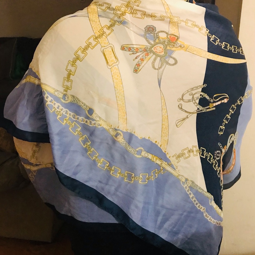 Luxurious wraparound faux silk scarf.